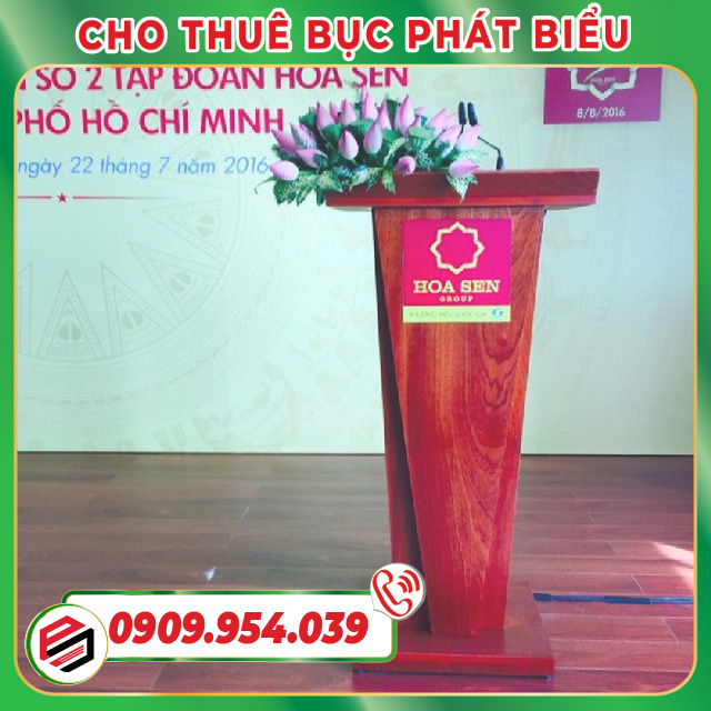 Wooden podium decorated with delicate lotus flowers